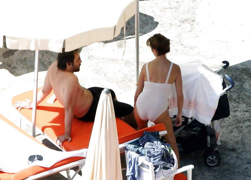 14P Penelope Cruz relaxing by the pool in a swimsuit