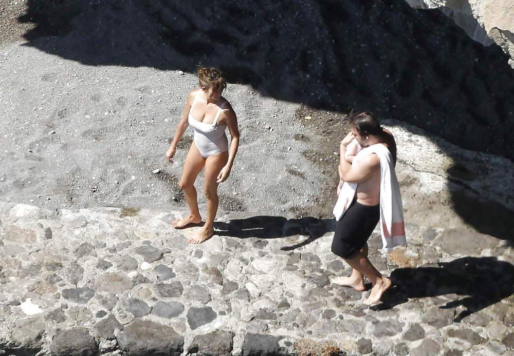 14P Penelope Cruz relaxing by the pool in a swimsuit