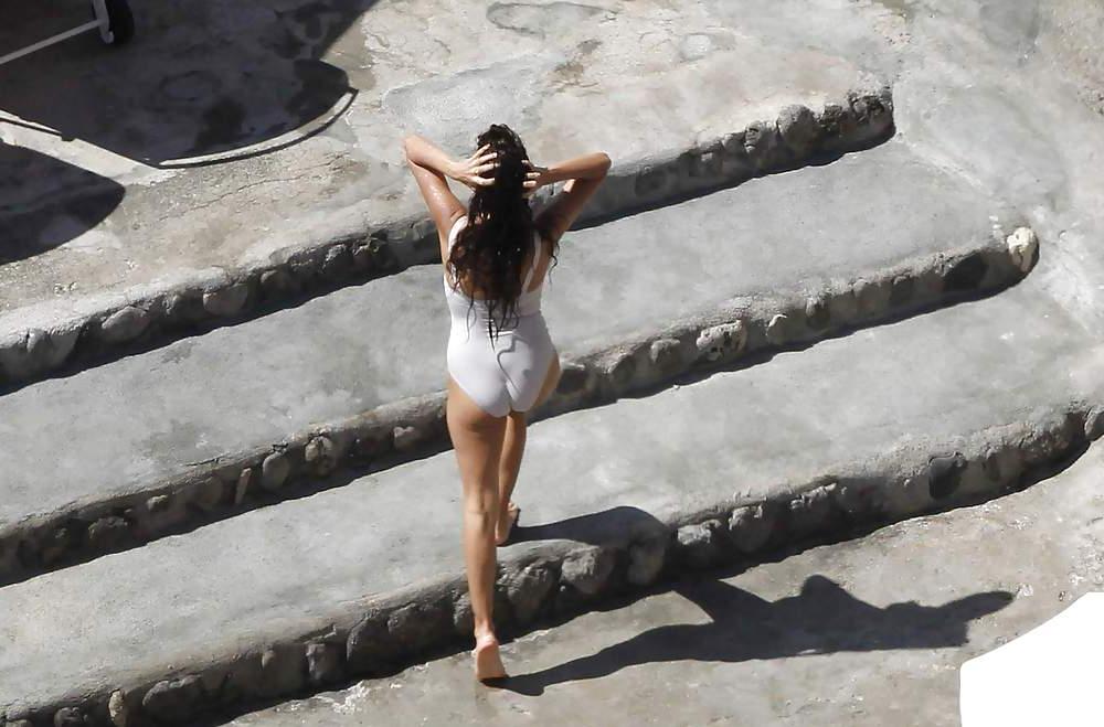 14P Penelope Cruz relaxing by the pool in a swimsuit