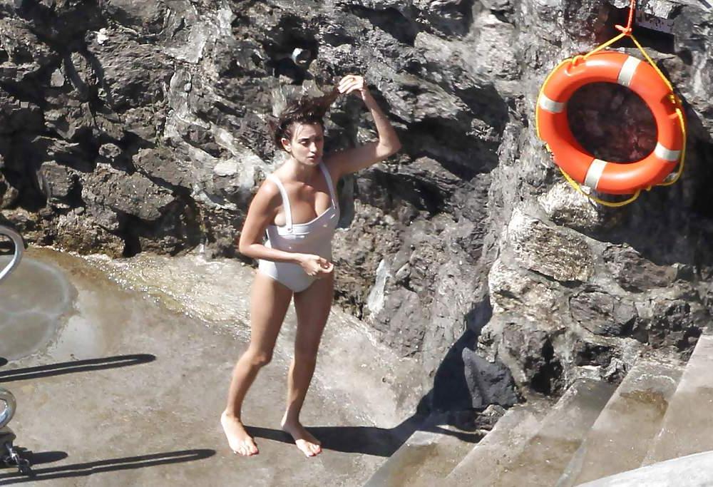 14P Penelope Cruz relaxing by the pool in a swimsuit