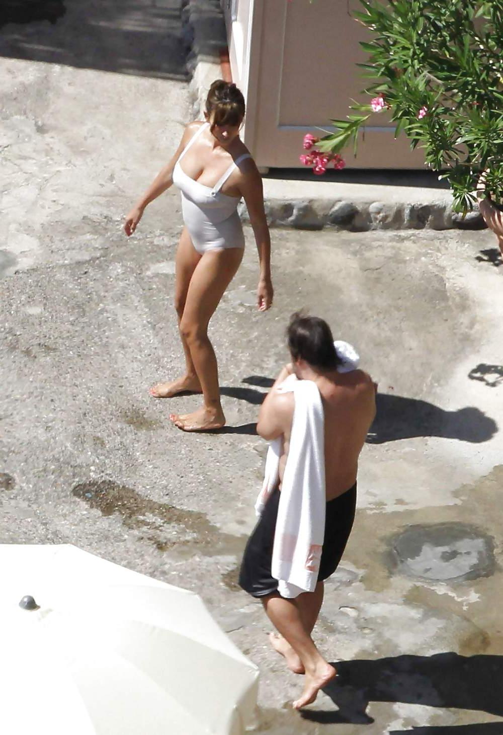 14P Penelope Cruz relaxing by the pool in a swimsuit