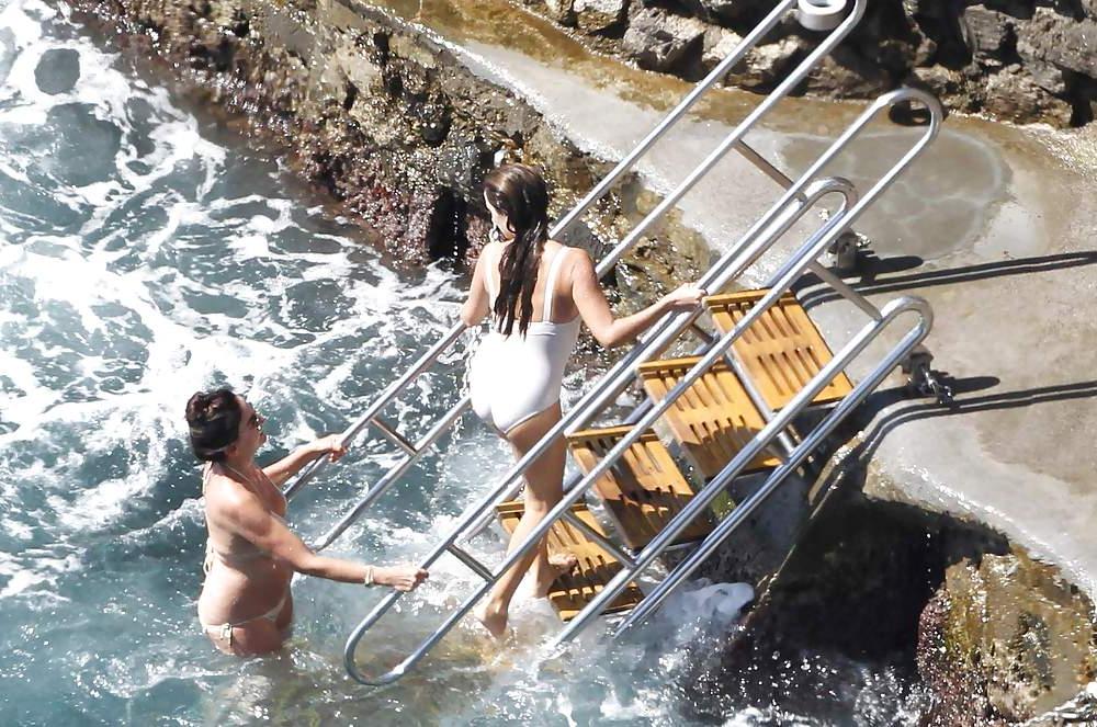 14P Penelope Cruz relaxing by the pool in a swimsuit