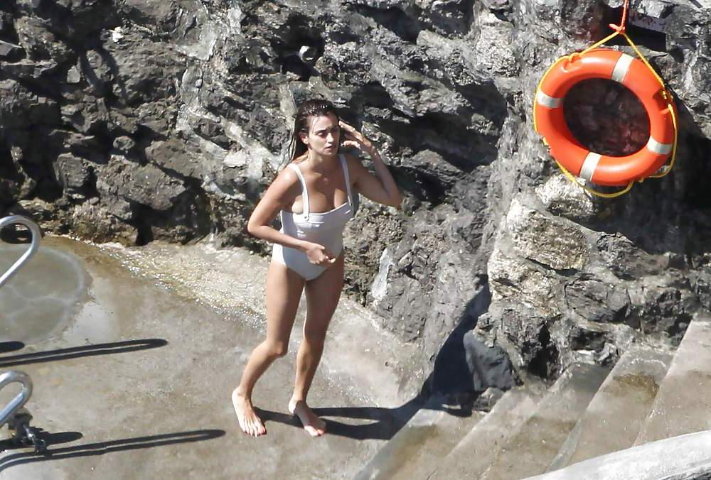 14P Penelope Cruz relaxing by the pool in a swimsuit