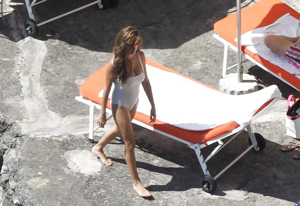 14P Penelope Cruz relaxing by the pool in a swimsuit