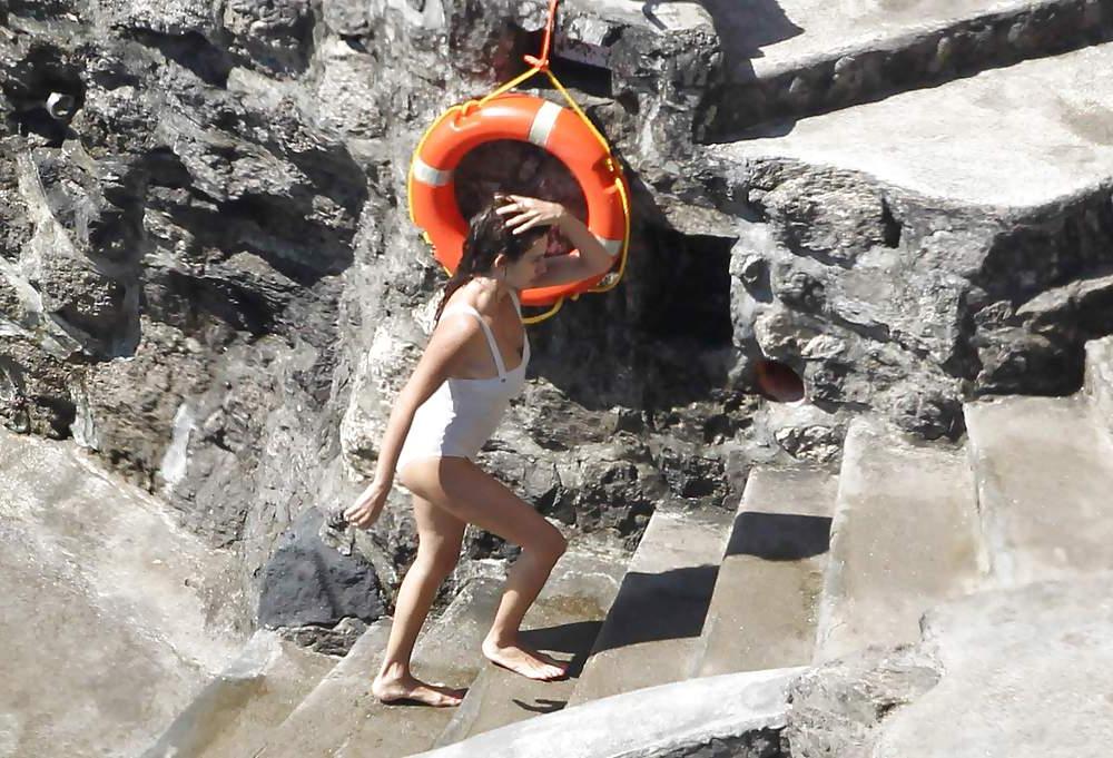 14P Penelope Cruz relaxing by the pool in a swimsuit