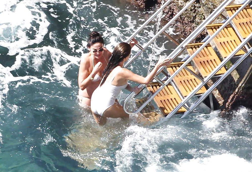 14P Penelope Cruz relaxing by the pool in a swimsuit