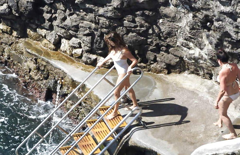 14P Penelope Cruz relaxing by the pool in a swimsuit