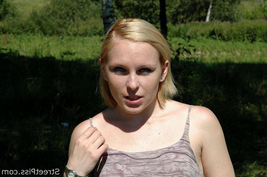 12P Tall young blonde makes a puddle on a forest glade