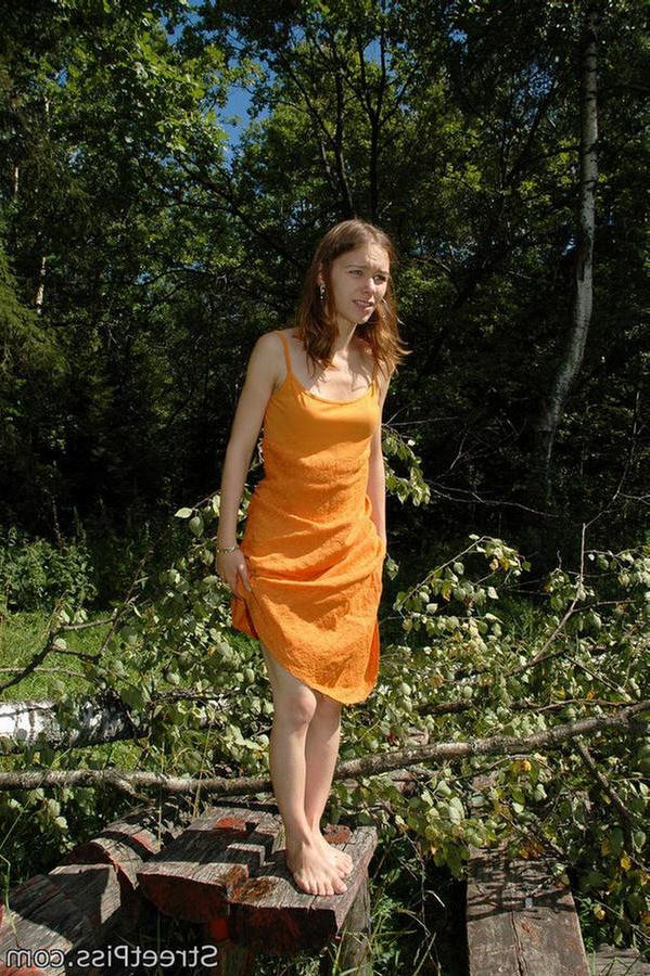 12P Young hottie in bright dress pees on forest wood