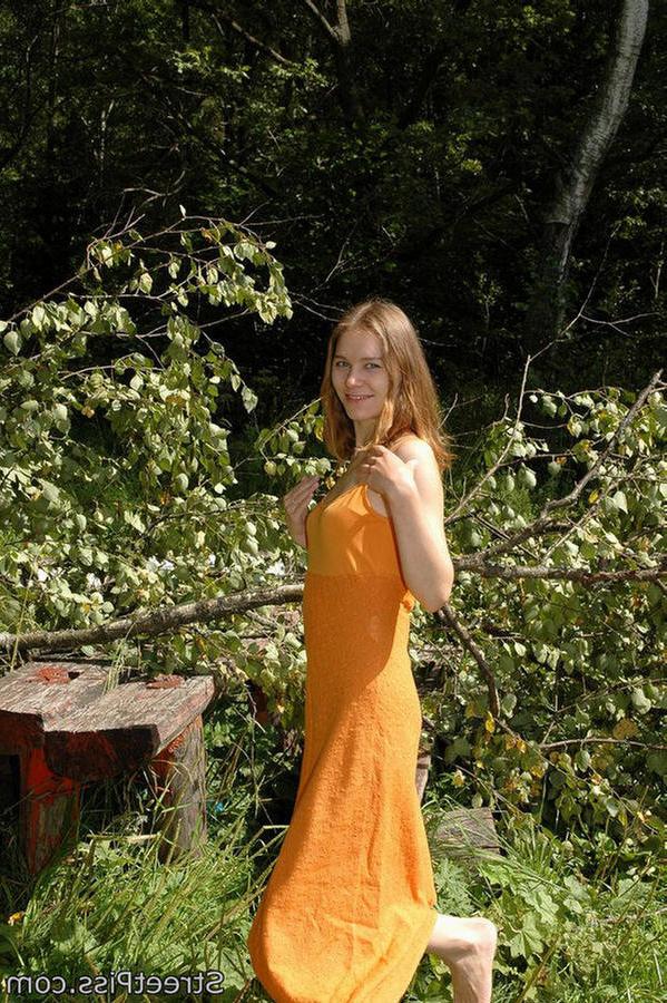 12P Young hottie in bright dress pees on forest wood