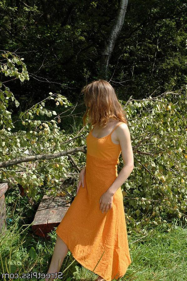 12P Young hottie in bright dress pees on forest wood