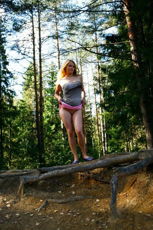 12P Pretty blonde babe with big tits takes a piss in the forest