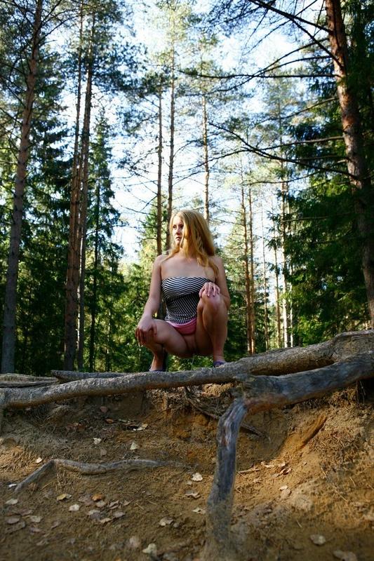 12P Pretty blonde babe with big tits takes a piss in the forest