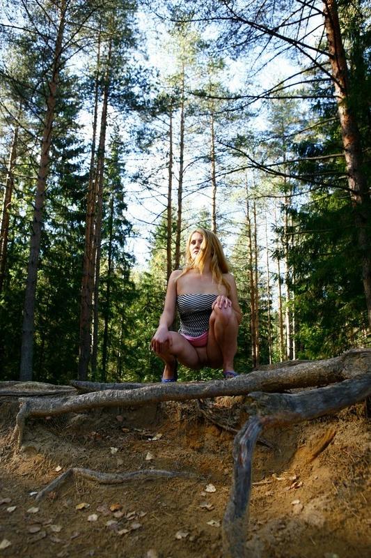 12P Pretty blonde babe with big tits takes a piss in the forest