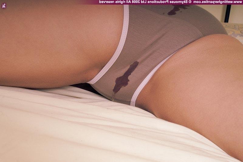 16P Hot teen babe pissing in her cotton panties in bed