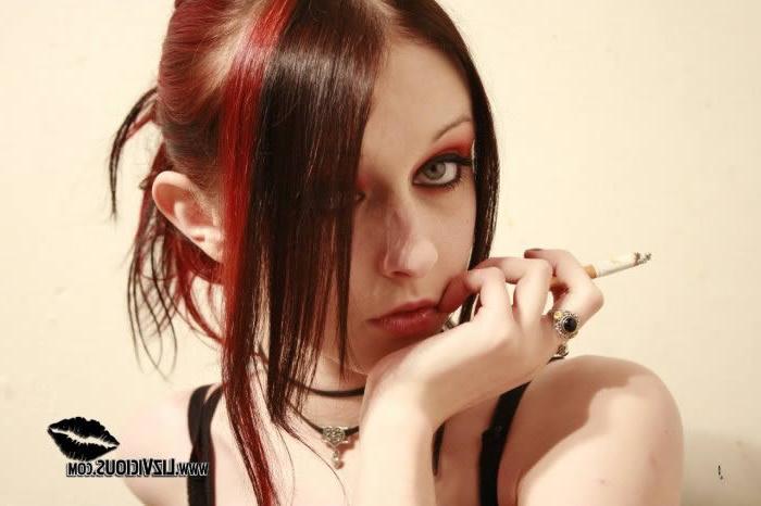 16P Smoking goth chick posing in her black corset