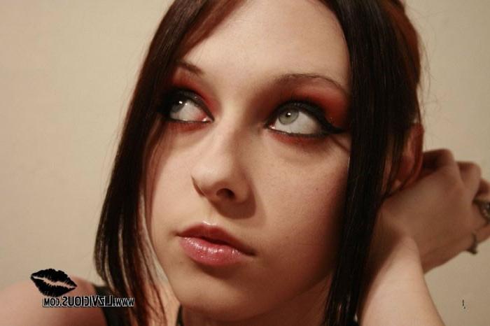 16P Smoking goth chick posing in her black corset