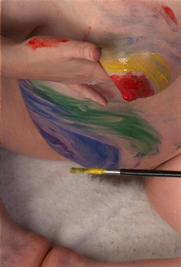 20P Pregnant beauty painting her body