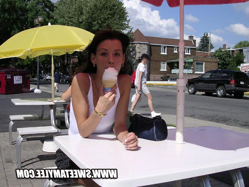 14P Cheerful brunette girl Sweet Amylee teasing in the city
