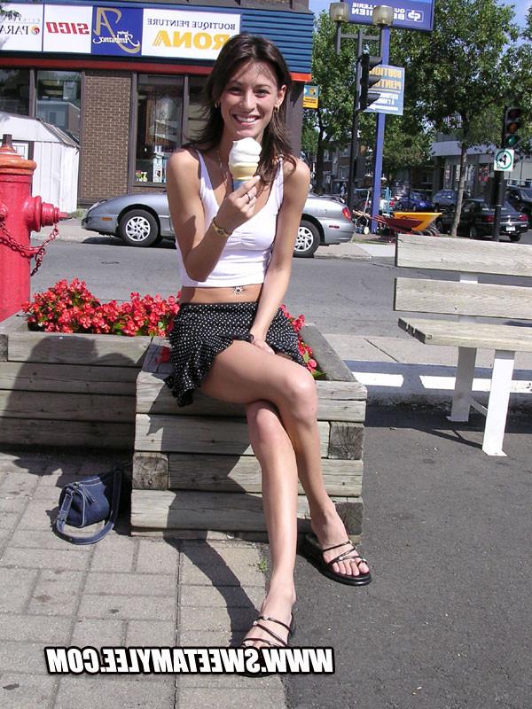 14P Cheerful brunette girl Sweet Amylee teasing in the city