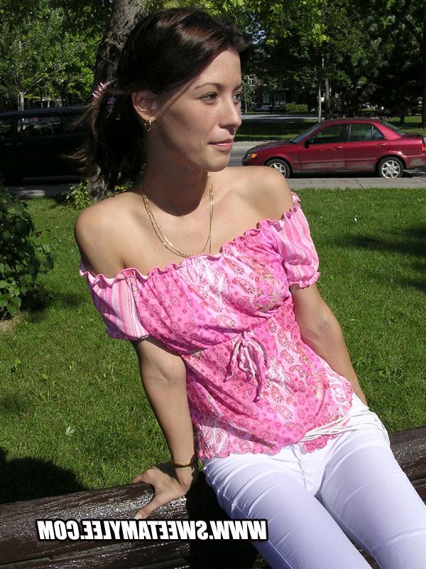 14P Cheerful brunette girl Sweet Amylee teasing in the city