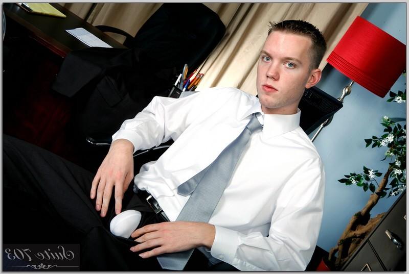 16P Hot young stud takes off his suit jerks off his big hard cock