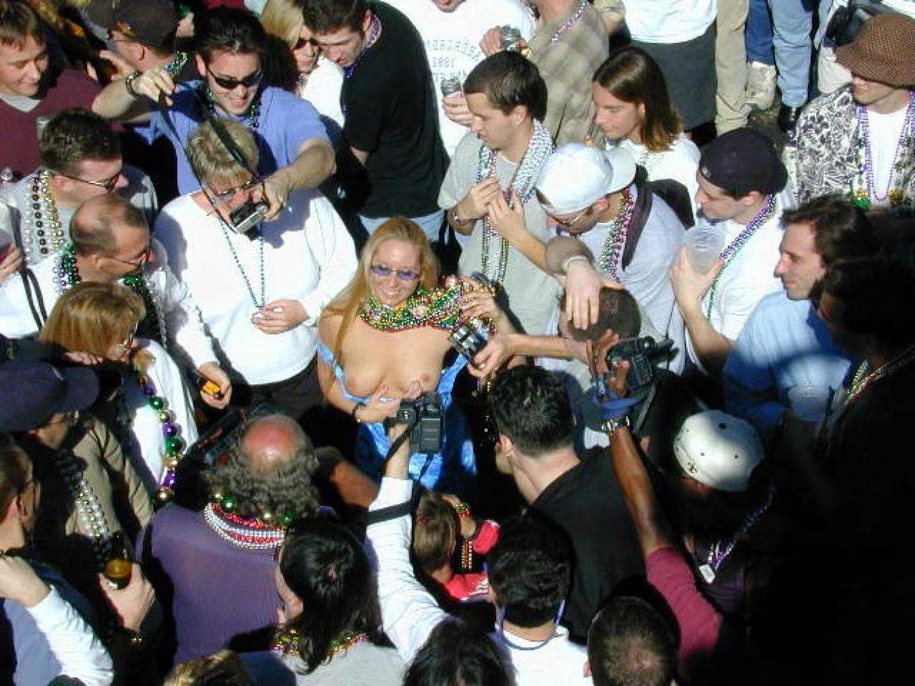 15P Drunk chicks showing tits and getting photographed at mardigras