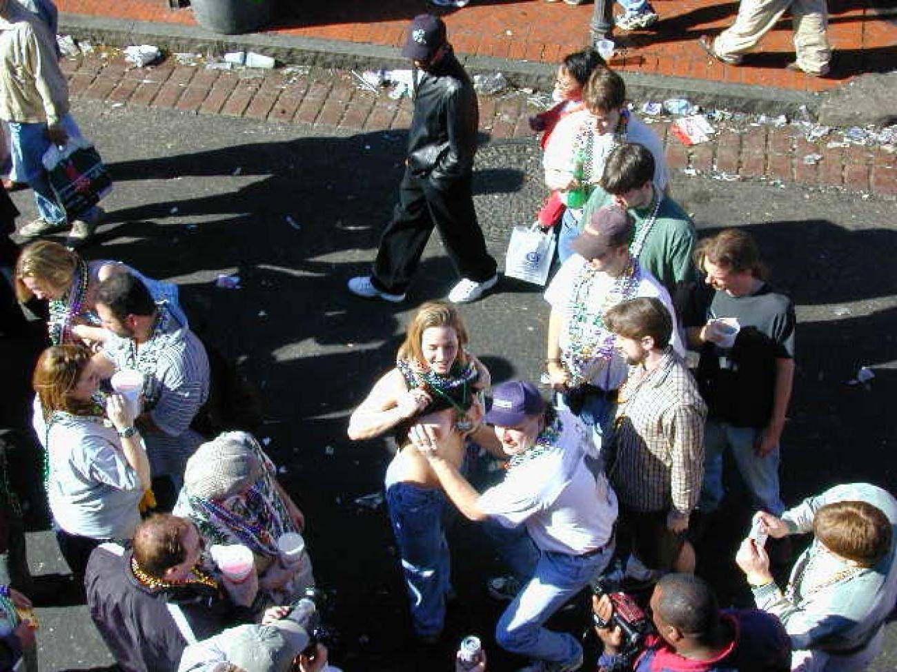 15P Drunk chicks showing tits and getting photographed at mardigras