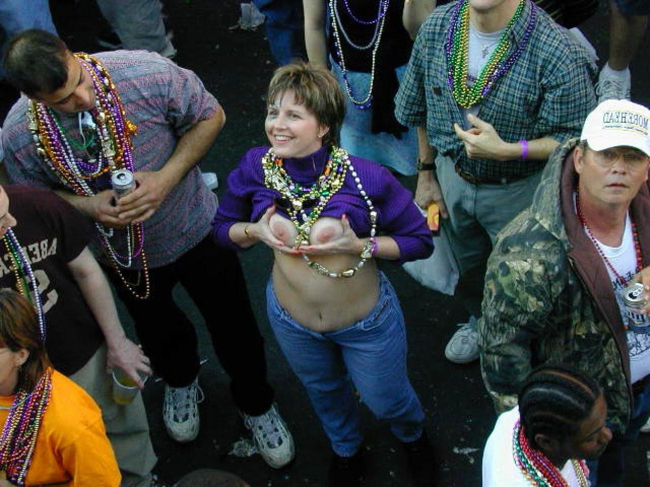 15P Drunk chicks showing tits and getting photographed at mardigras