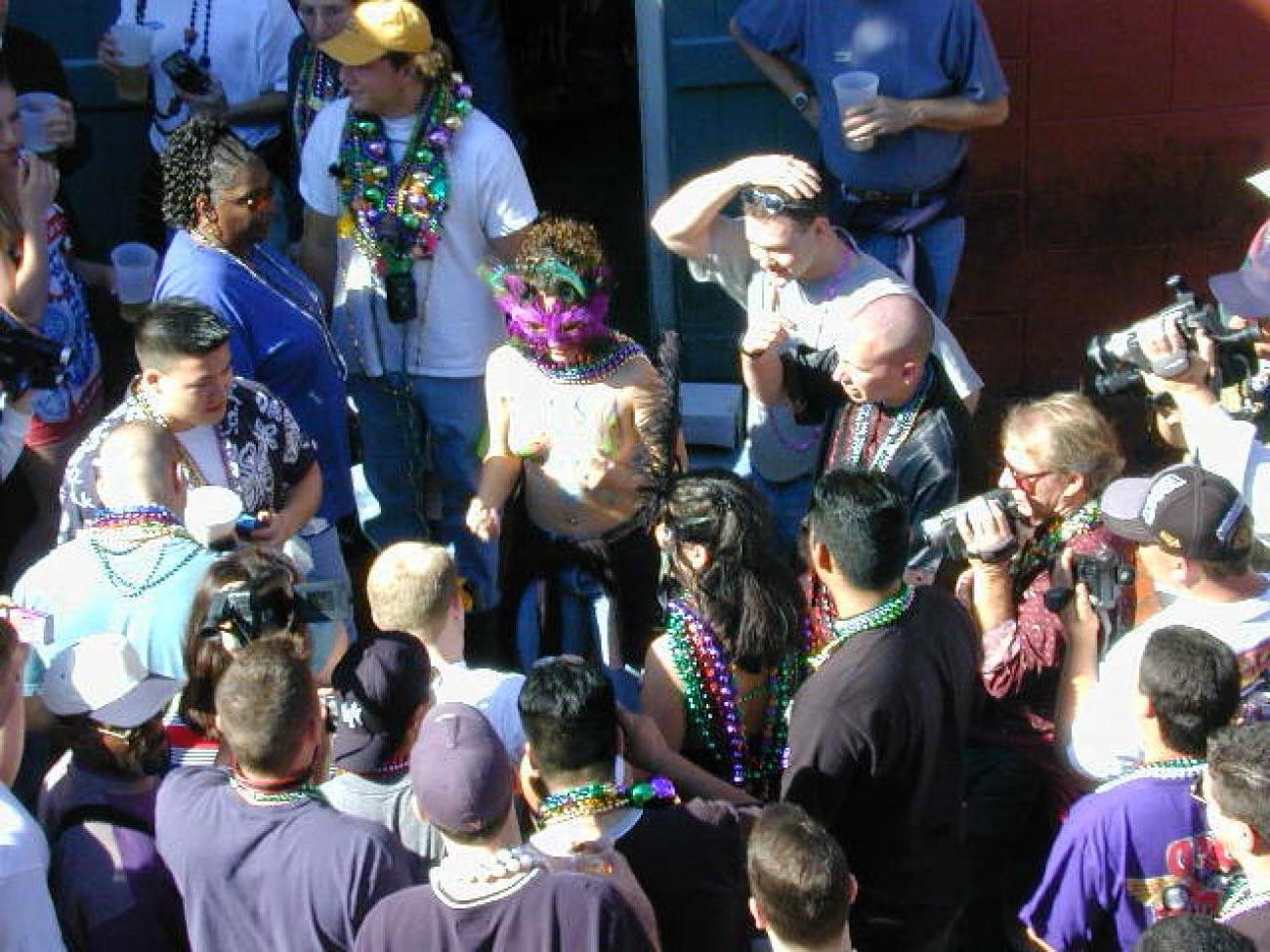 15P Drunk chicks showing tits and getting photographed at mardigras