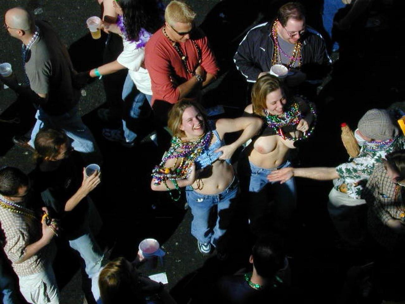 15P Drunk chicks showing tits and getting photographed at mardigras