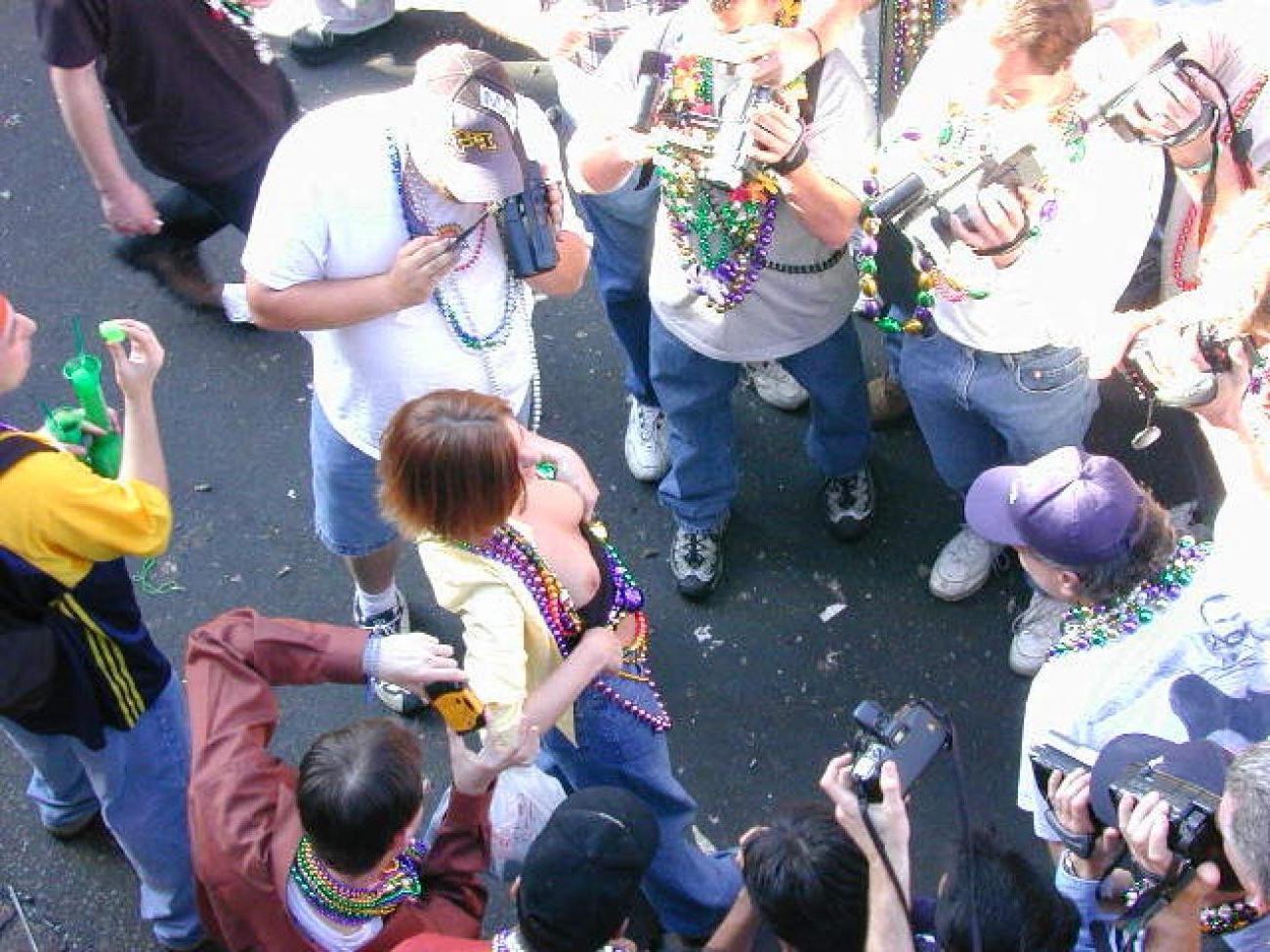 15P Drunk chicks showing tits and getting photographed at mardigras