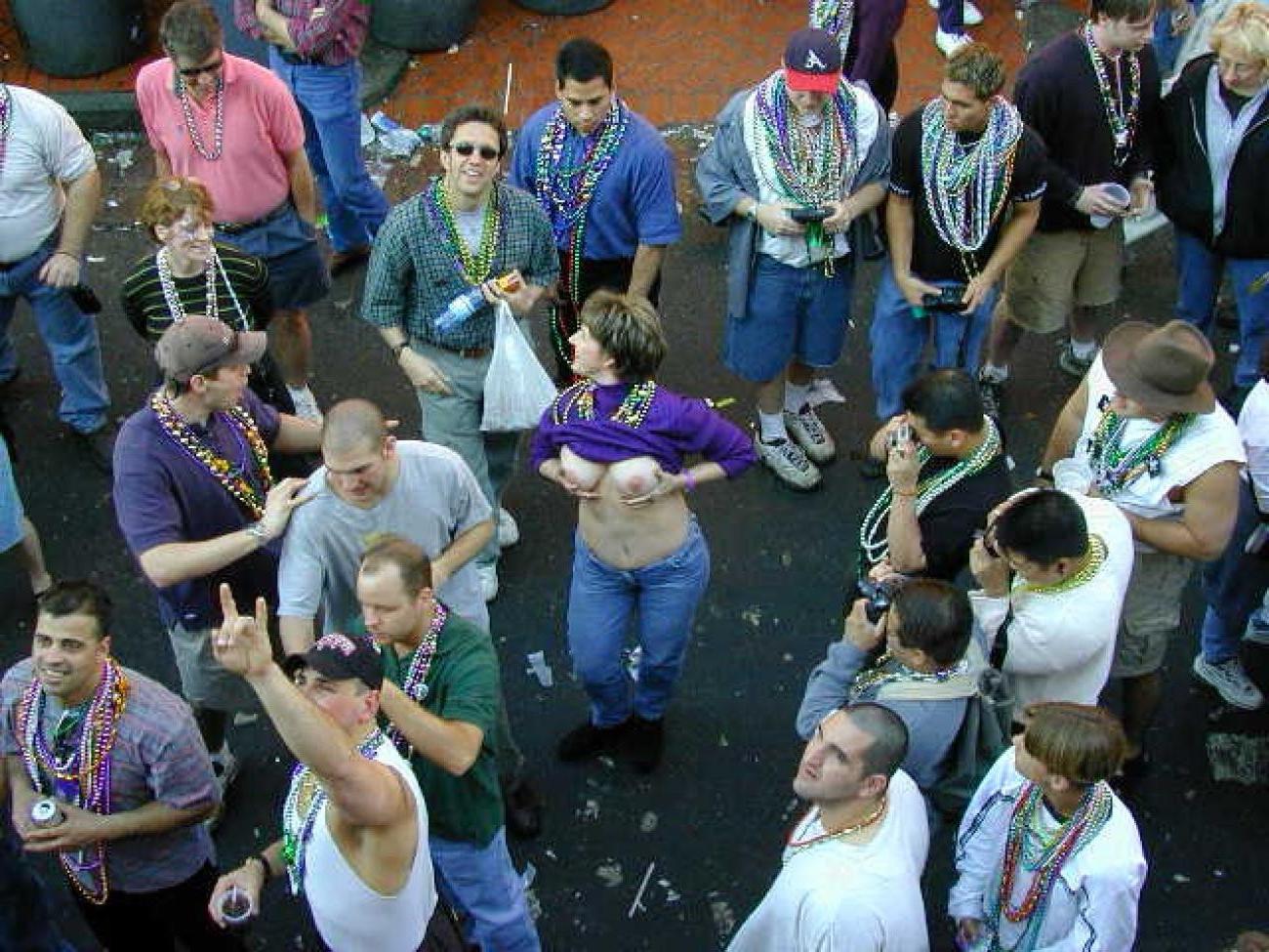 15P Drunk chicks showing tits and getting photographed at mardigras