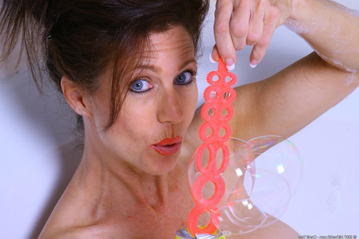 15P Horny milf with round juggs having fun in a hot tub