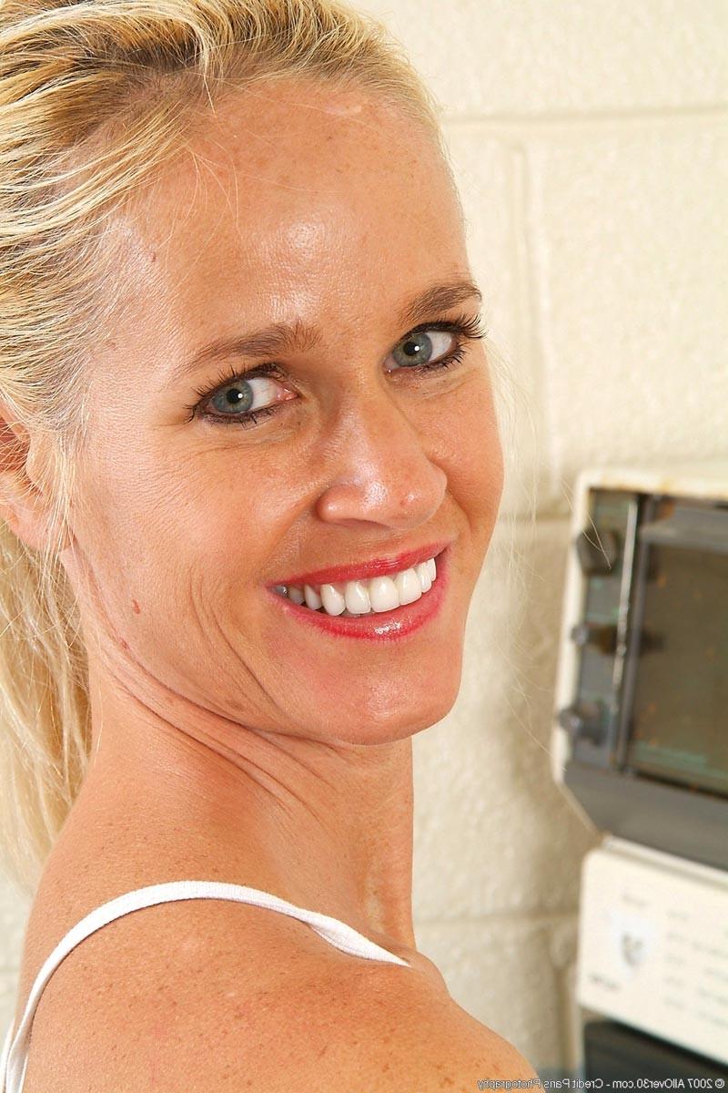 15P Hot busty milf getting kinky in the kitchen
