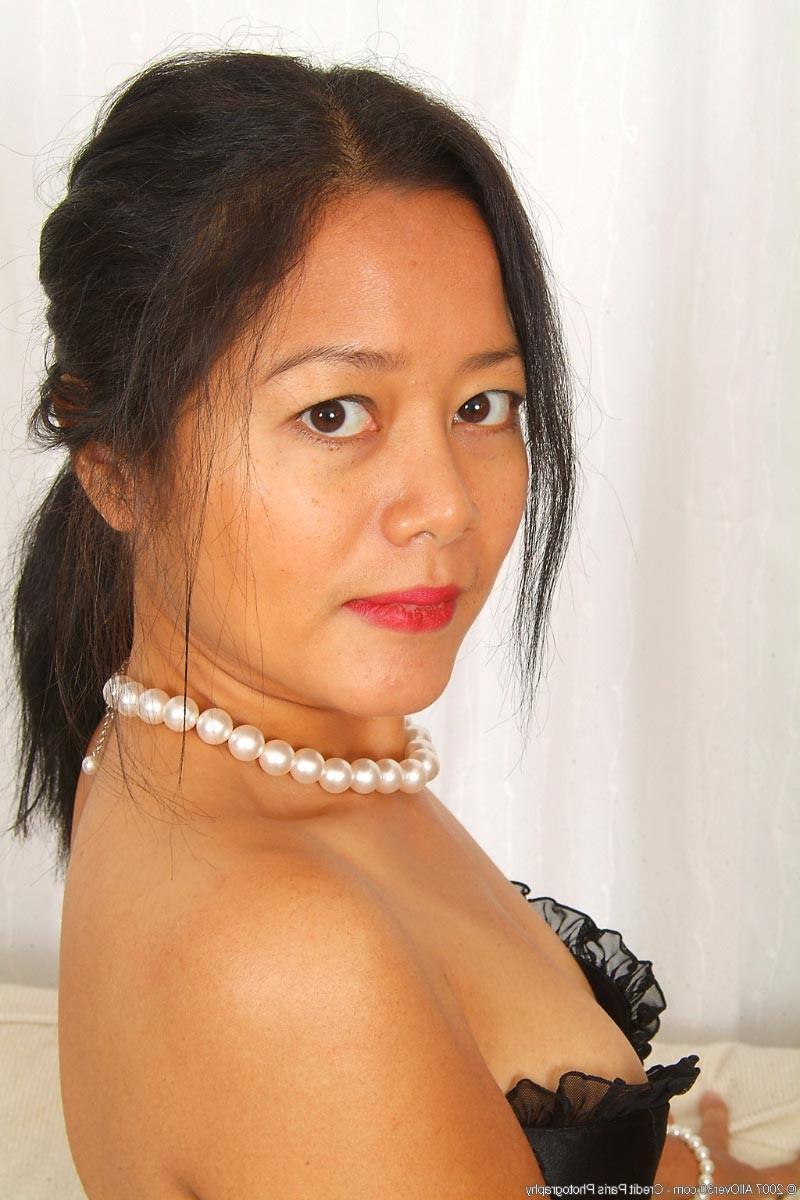 15P Petite brunette milf stripping off her lingerie