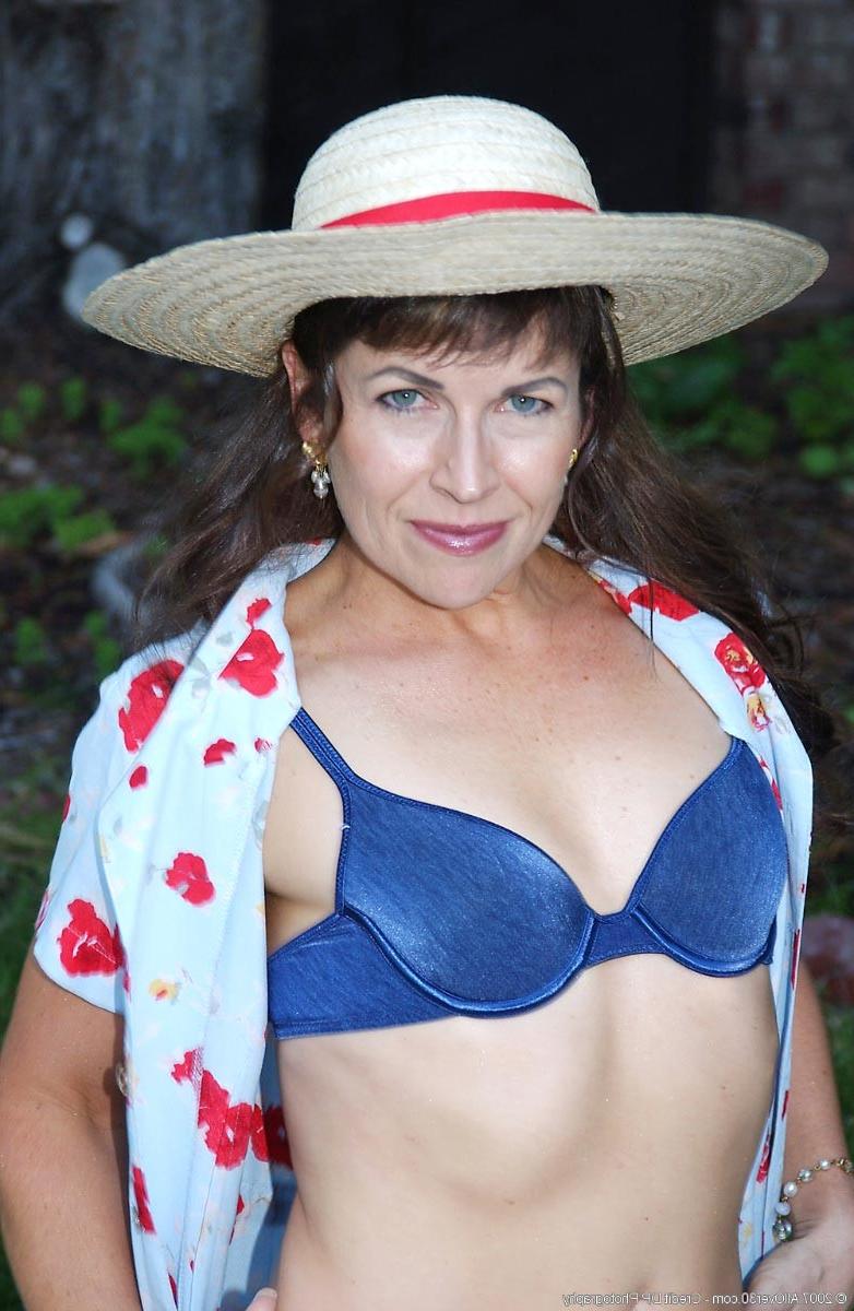 15P Horny milf with small tits having fun in the yard