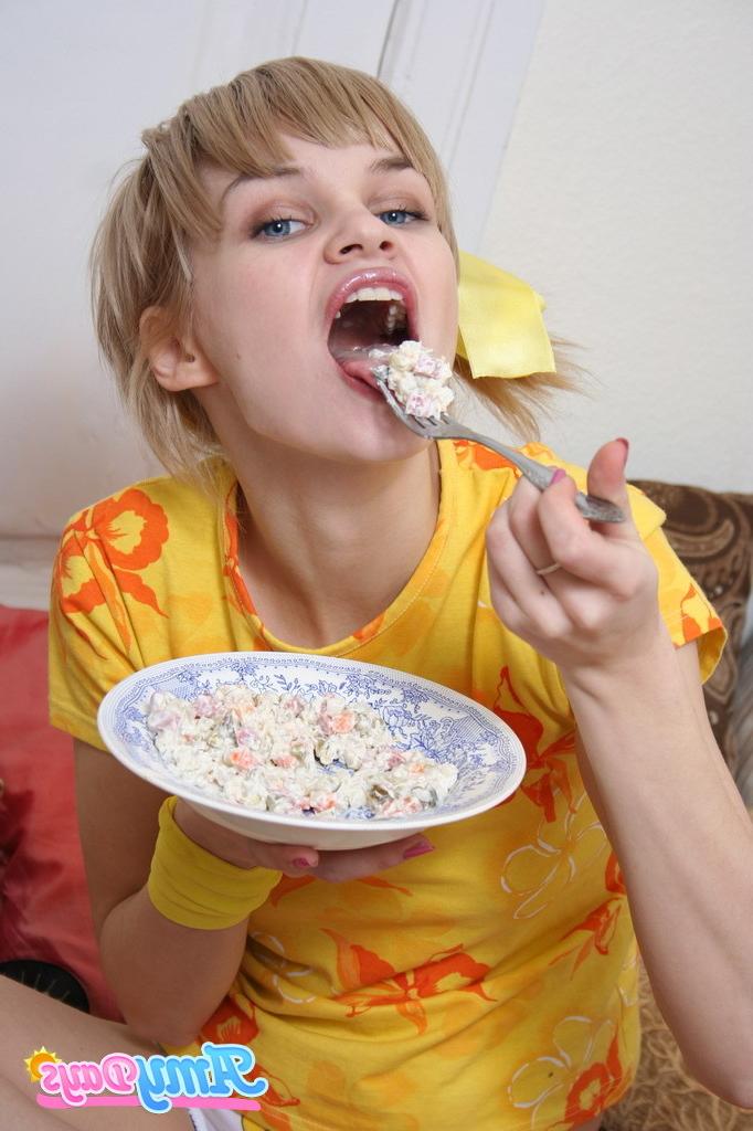 16P Funny teen girl eating food
