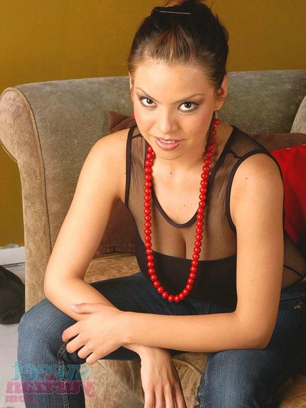 15P Yurizan Beltran posing in a pair of blue jeans and a one piece suit