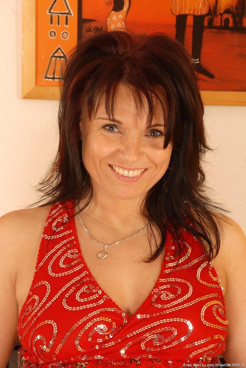 15P Horny mature strips off her seductive red dress