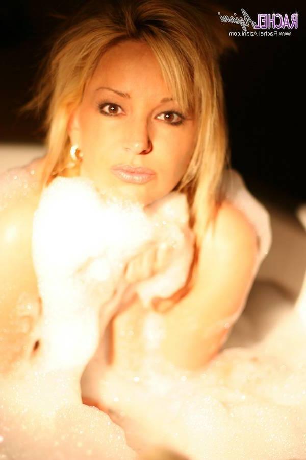 15P Busty milf soaps up her huge tits and cunt in the tub