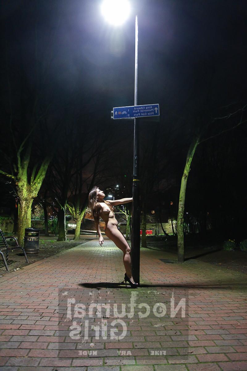 8P A girls is posing nude in the night time outdoor