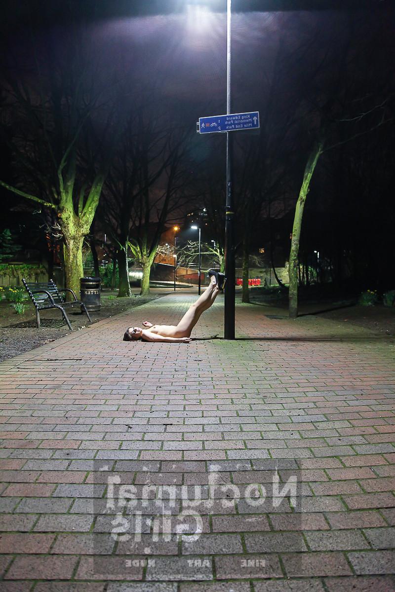 8P A girls is posing nude in the night time outdoor