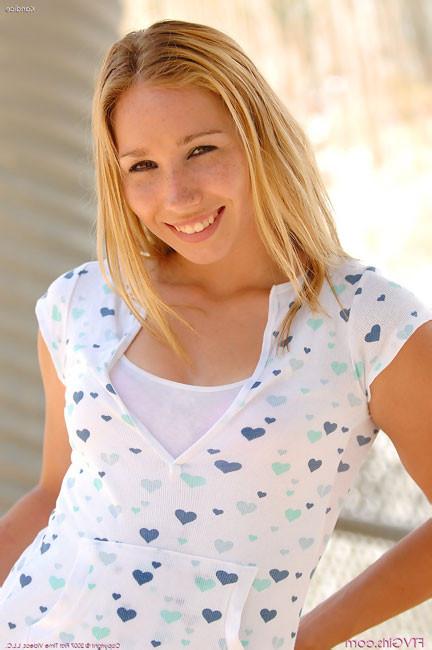 15P Freckled teen frolics outside with no panties