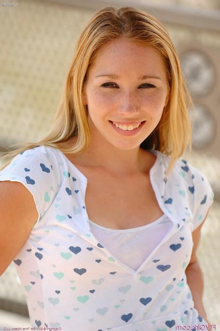 15P Freckled teen frolics outside with no panties