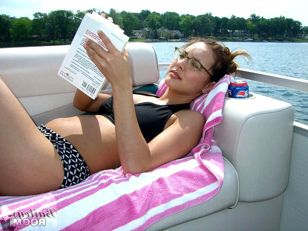 15P Teen on a boat gets a tan while reading topless