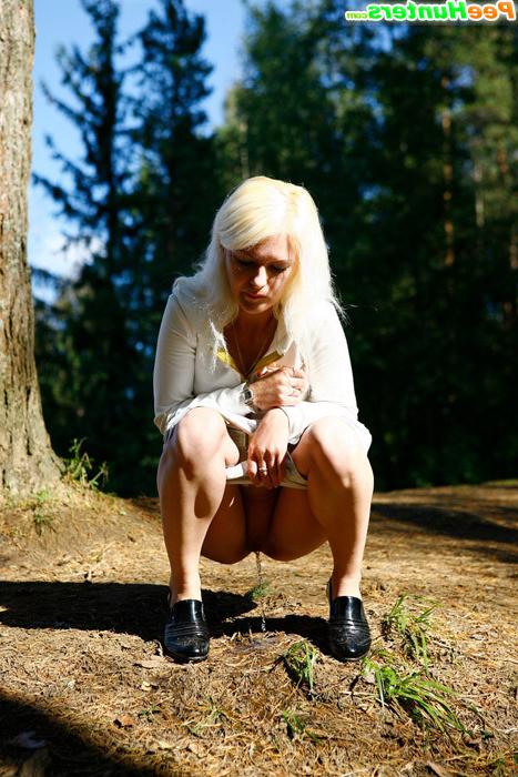 16P Naughty blonde pisses into a sandpit in forest