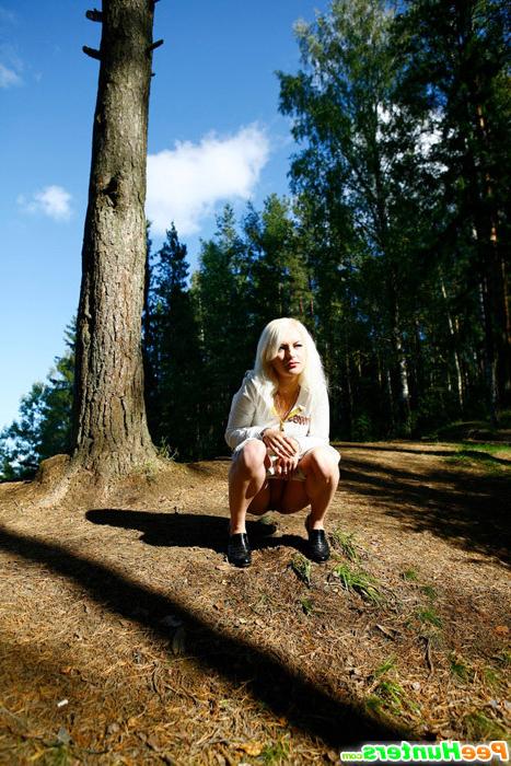 16P Naughty blonde pisses into a sandpit in forest