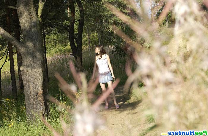 16P Beautiful kitty plays watersports on a quiet forest glade