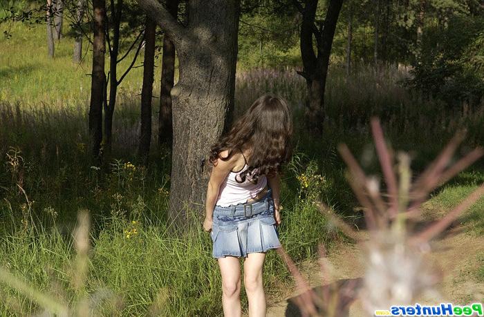 16P Beautiful kitty plays watersports on a quiet forest glade